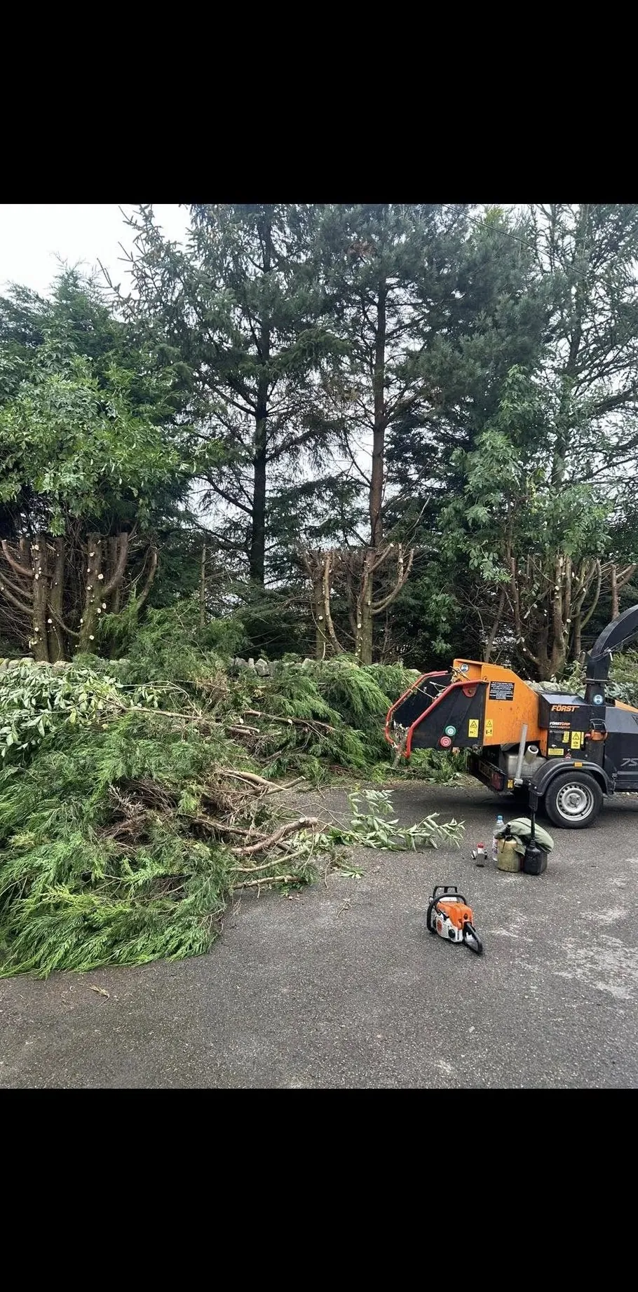 Storm fall tree clearance with chipper