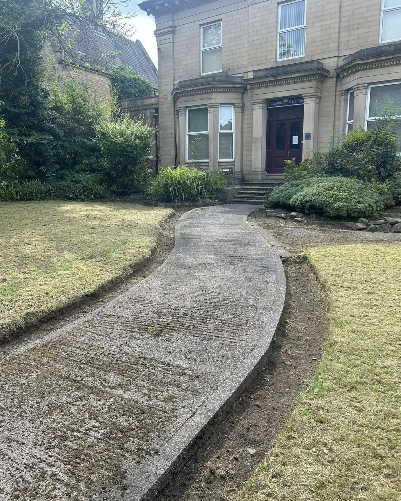 Stone house with gravel path landscaping