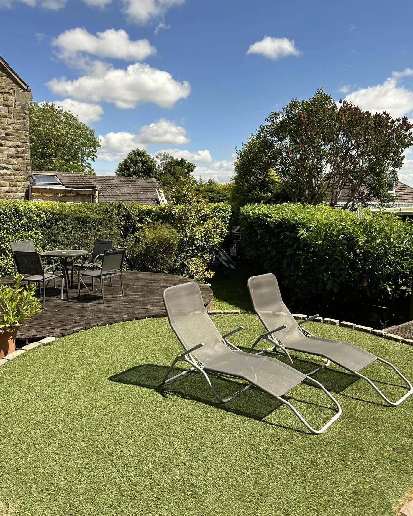 Relaxing lawn area after garden maintenance